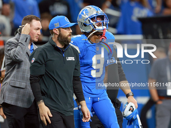 DETROIT,MICHIGAN-SEPTEMBER 8:  Wide receiver Jameson Williams (9) of the Detroit Lions walks off the field after being checked for injury du...