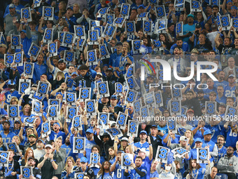 DETROIT,MICHIGAN-SEPTEMBER 8:  Fans hold signs for a third down in the stands during a game between the Detroit Lions and the Los Angeles Ra...