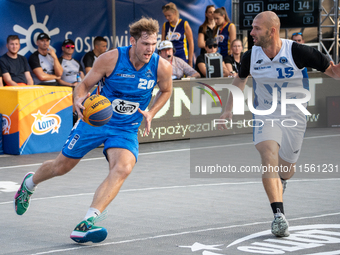 Maksymilian Szefler and Marcin Zarzeczny participate in the LOTTO 3x3 League basketball game in Sosnowiec, Poland, on September 8, 2024. The...