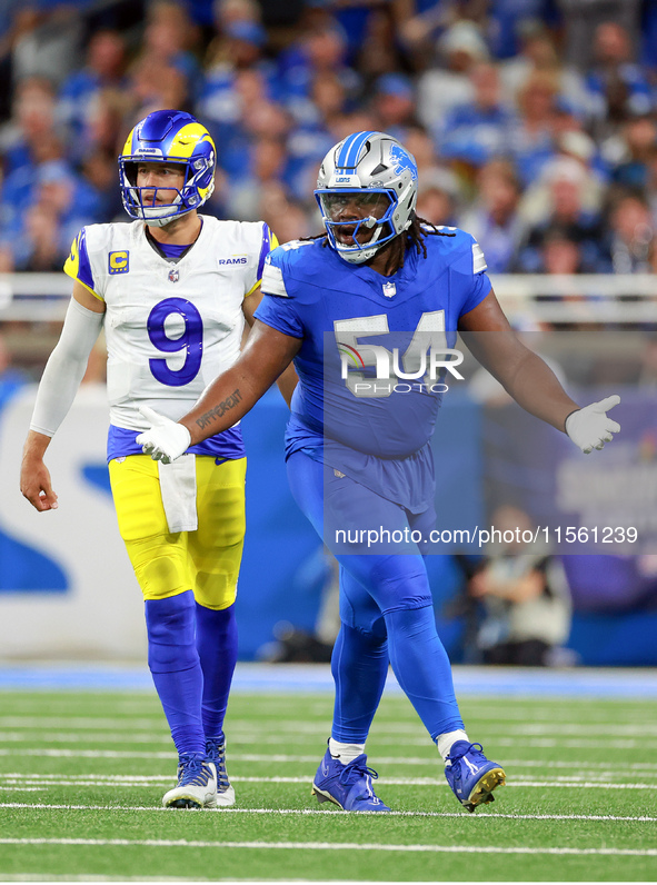 DETROIT,MICHIGAN-SEPTEMBER 8: Defensive tackle Alim McNeill (54) of the Detroit Lions gestures after a play with quarterback Matthew Staffor...