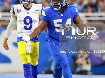 DETROIT,MICHIGAN-SEPTEMBER 8: Defensive tackle Alim McNeill (54) of the Detroit Lions gestures after a play with quarterback Matthew Staffor...