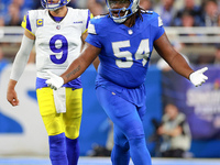 DETROIT,MICHIGAN-SEPTEMBER 8: Defensive tackle Alim McNeill (54) of the Detroit Lions gestures after a play with quarterback Matthew Staffor...