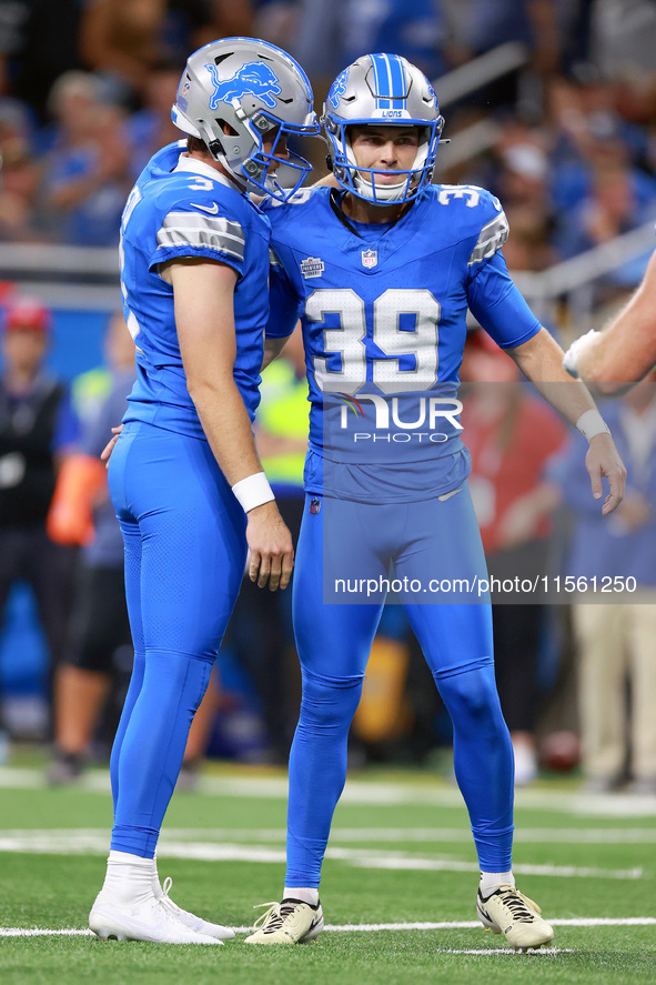 DETROIT,MICHIGAN-SEPTEMBER 8:  Detroit Lions place kicker Jake Bates is congratulated by punter Jack Fox (3) of the Detroit Lions after maki...