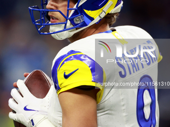 DETROIT,MICHIGAN-SEPTEMBER 9: Quarterback Matthew Stafford (9) of the Los Angeles Rams prepares to throw the ball ahead of a game between th...