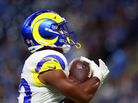 DETROIT,MICHIGAN-SEPTEMBER 8:  Running back Ronnie Rivers (20) of the Los Angeles Rams catches the ball during warmups ahead of a game betwe...