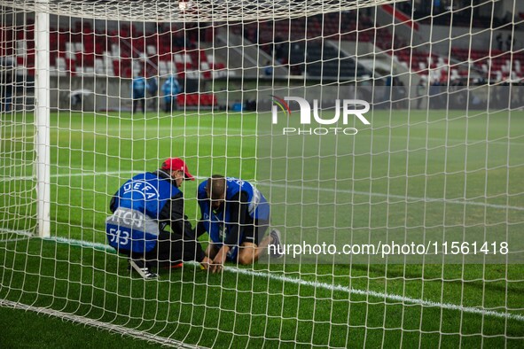 Pitch maintenance takes place prior to the UEFA Nations League 2024/25 League A Group A2 match between Israel and Italy at Bozsik Arena Stad...