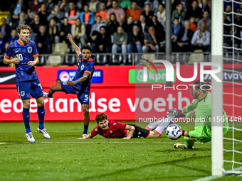 Netherlands player Youri Regeer, Netherlands player Ian Maatsen, and Georgia goalkeeper Luka Kharatishvili during the match between the Neth...