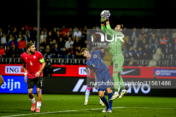 Netherlands player Youri Baas and Georgia goalkeeper Luka Kharatishvili during the match between the Netherlands and Georgia at the Covebo S...