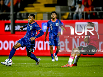 Netherlands player Antoni Milambo and Georgia player Otar Mamageishvili during the match between the Netherlands and Georgia at the Covebo S...