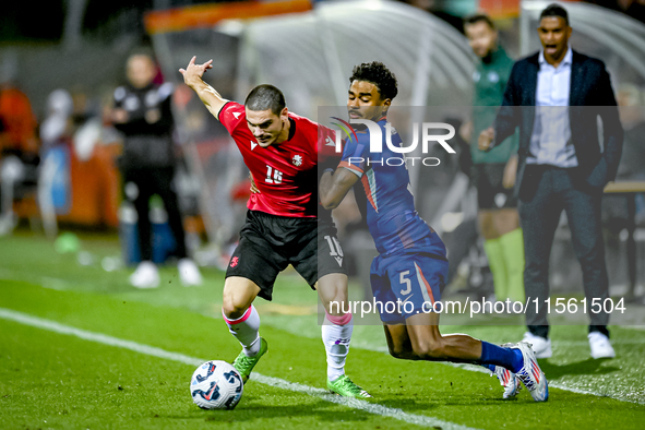 Georgia player Davit Zurabiani and Netherlands player Ian Maatsen during the match between the Netherlands and Georgia at the Covebo Stadium...