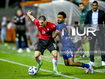 Georgia player Davit Zurabiani and Netherlands player Ian Maatsen during the match between the Netherlands and Georgia at the Covebo Stadium...