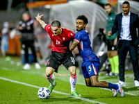 Georgia player Davit Zurabiani and Netherlands player Ian Maatsen during the match between the Netherlands and Georgia at the Covebo Stadium...