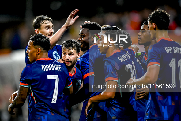 Players of the Netherlands celebrate the goal of Netherlands player Noah Ohio, making the score 3-1, during the match between the Netherland...