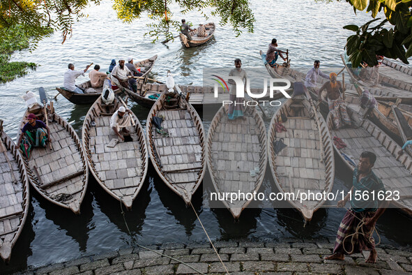 Boatmen wait for passengers at a ghat in Dhaka, Bangladesh, on September 9, 2024. 