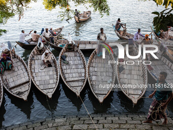 Boatmen wait for passengers at a ghat in Dhaka, Bangladesh, on September 9, 2024. (