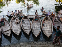 Boatmen wait for passengers at a ghat in Dhaka, Bangladesh, on September 9, 2024. (