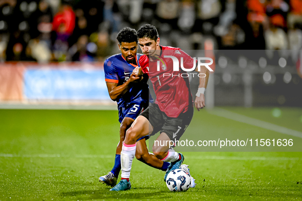 Netherlands player Ian Maatsen and Georgia player Lasha Odisharia during the match between the Netherlands and Georgia at the Covebo Stadium...