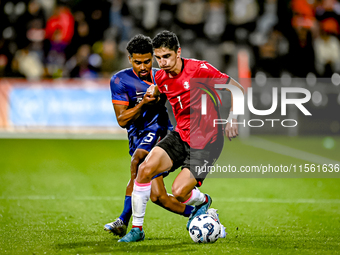 Netherlands player Ian Maatsen and Georgia player Lasha Odisharia during the match between the Netherlands and Georgia at the Covebo Stadium...