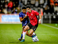 Netherlands player Ian Maatsen and Georgia player Lasha Odisharia during the match between the Netherlands and Georgia at the Covebo Stadium...