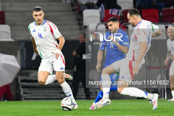 Alessandro Buongiorno and Liel Abada are in action during Israel vs. Italy: matchday 2 of UEFA Nations League 2024-2025, in Budapest, Hungar...