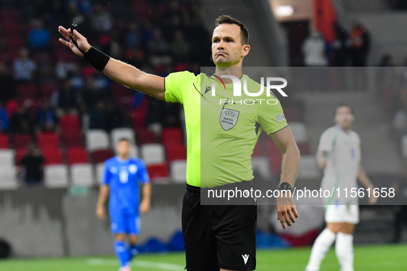 Ivan Kruzliak (SVK), central referee, officiates during Israel vs Italy: matchday 2 of UEFA Nations League 2024-2025, in Budapest, Hungary,...