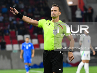 Ivan Kruzliak (SVK), central referee, officiates during Israel vs Italy: matchday 2 of UEFA Nations League 2024-2025, in Budapest, Hungary,...