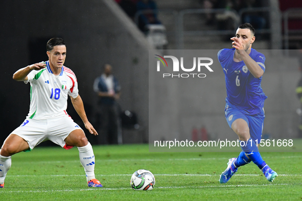 Giacomo Raspadori and Neta Lavi in action during Israel vs Italy: matchday 2 of UEFA Nations League 2024-2025, in Budapest, Hungary, on Sept...