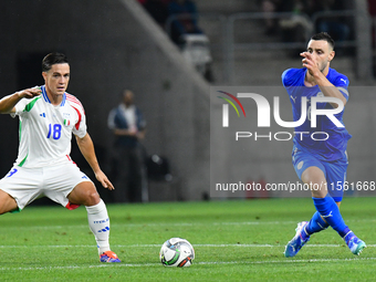 Giacomo Raspadori and Neta Lavi in action during Israel vs Italy: matchday 2 of UEFA Nations League 2024-2025, in Budapest, Hungary, on Sept...