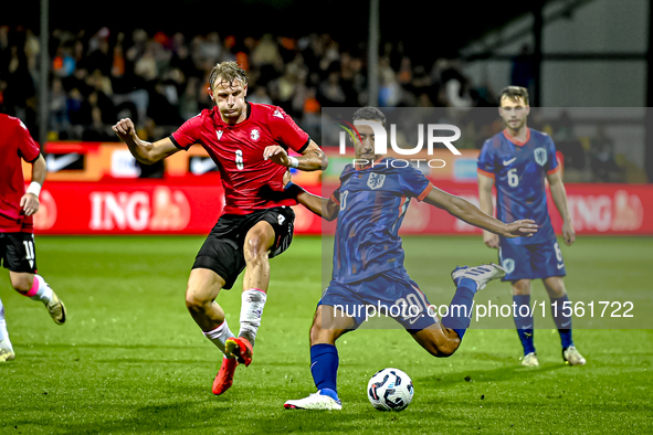 Georgia player Nodari Lominadze and Netherlands player Anass Salah-Eddine during the match between the Netherlands and Georgia at the Covebo...