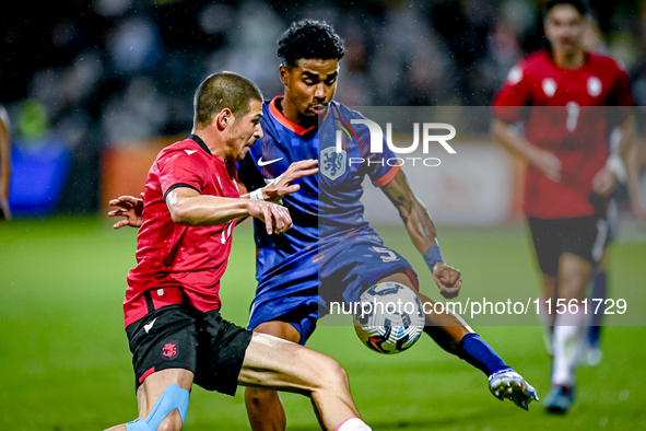 Georgia player Nodari Lominadze and Netherlands player Ian Maatsen during the match between the Netherlands and Georgia at the Covebo Stadiu...