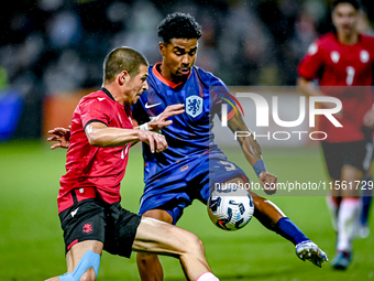 Georgia player Nodari Lominadze and Netherlands player Ian Maatsen during the match between the Netherlands and Georgia at the Covebo Stadiu...