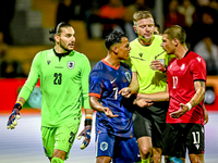 Georgia goalkeeper Luka Kharatishvili, Netherlands player Million Manhoef, referee Robert Schroder, and Georgia player Levan Osikmashvili du...