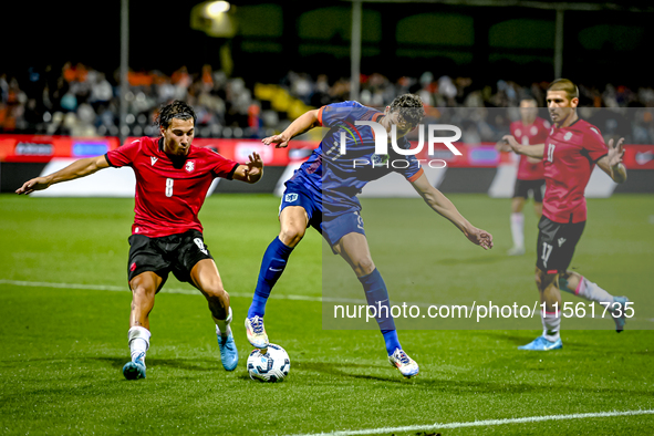 Georgia player Nodari Lominadze and Netherlands player Ruben van Bommel during the match between the Netherlands and Georgia at the Covebo S...