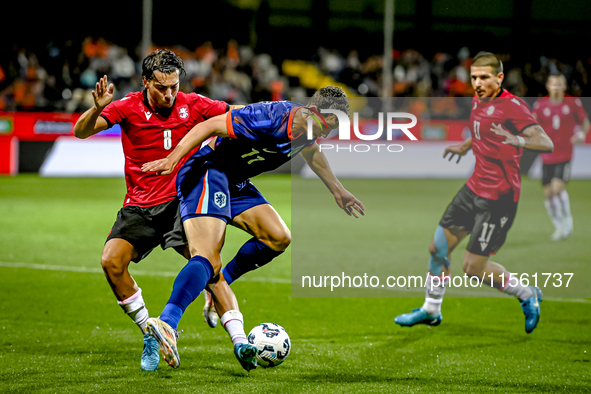 Georgia player Otar Mamageishvili and Netherlands player Ruben van Bommel during the match between the Netherlands and Georgia at the Covebo...