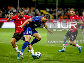 Georgia player Otar Mamageishvili and Netherlands player Ruben van Bommel during the match between the Netherlands and Georgia at the Covebo...