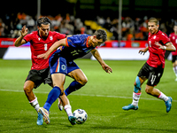 Georgia player Otar Mamageishvili and Netherlands player Ruben van Bommel during the match between the Netherlands and Georgia at the Covebo...