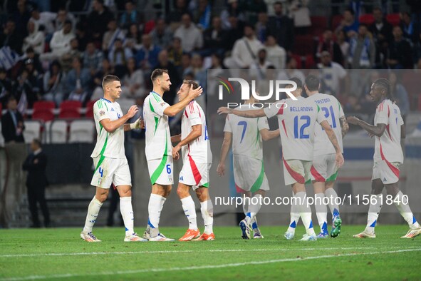 Davide Frattesi celebrates his goal with teammates during the UEFA Nations League 2024/25 League A Group A2 match between Israel and Italy a...