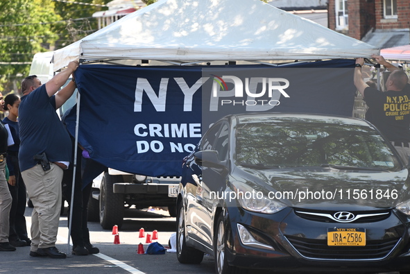 Crime scene investigators investigate the scene, place evidence markers, and search for clues after a 46-year-old male is shot multiple time...