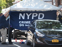 Crime scene investigators investigate the scene, place evidence markers, and search for clues after a 46-year-old male is shot multiple time...