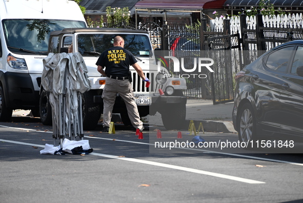 Crime scene investigators investigate the scene, place evidence markers, and search for clues after a 46-year-old male is shot multiple time...