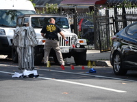 Crime scene investigators investigate the scene, place evidence markers, and search for clues after a 46-year-old male is shot multiple time...