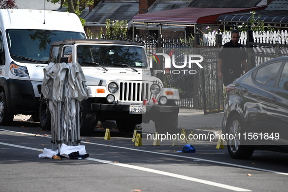 Crime scene investigators investigate the scene, place evidence markers, and search for clues after a 46-year-old male is shot multiple time...