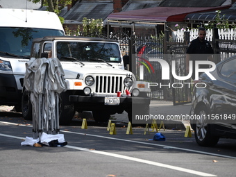 Crime scene investigators investigate the scene, place evidence markers, and search for clues after a 46-year-old male is shot multiple time...