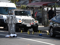 Crime scene investigators investigate the scene, place evidence markers, and search for clues after a 46-year-old male is shot multiple time...