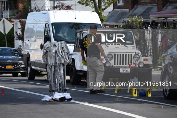 Crime scene investigators investigate the scene, place evidence markers, and search for clues after a 46-year-old male is shot multiple time...