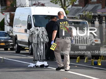 Crime scene investigators investigate the scene, place evidence markers, and search for clues after a 46-year-old male is shot multiple time...