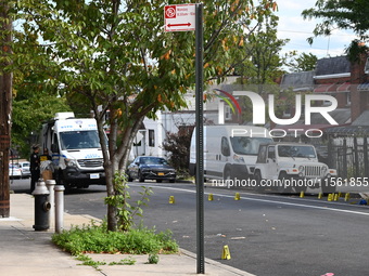 Crime scene investigators investigate the scene, place evidence markers, and search for clues after a 46-year-old male is shot multiple time...