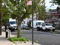 Crime scene investigators investigate the scene, place evidence markers, and search for clues after a 46-year-old male is shot multiple time...