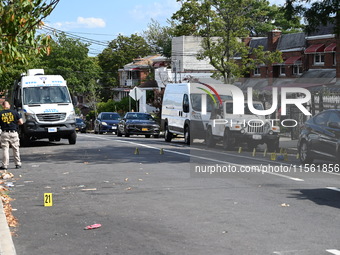 Crime scene investigators investigate the scene, place evidence markers, and search for clues after a 46-year-old male is shot multiple time...