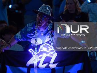 DETROIT,MICHIGAN-SEPTEMBER 8: Detroit Lions fan cheers during the first half of an NFL football game between the Los Angeles Rams and the De...